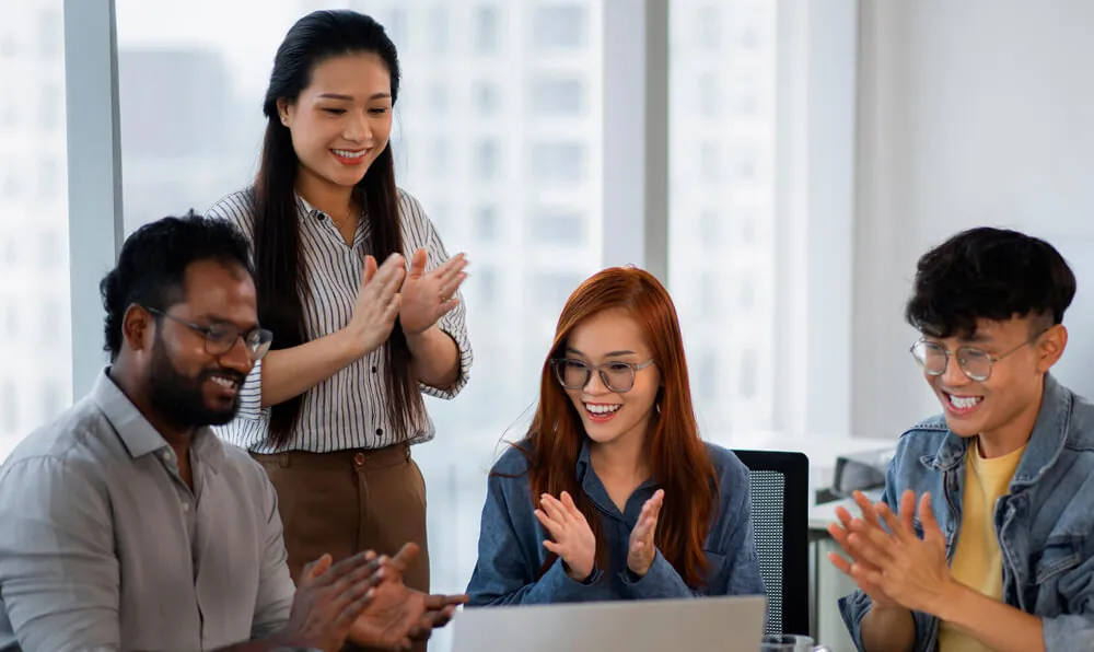 Marketing team celebrating campaign results