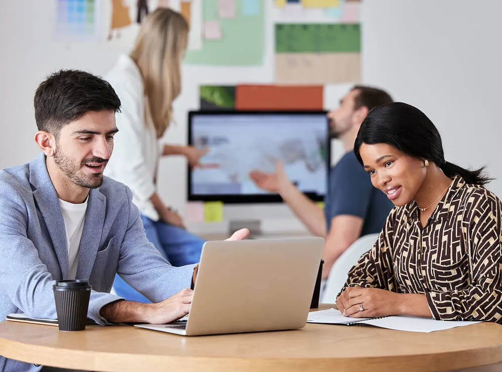 Friendly Infotech developers with a client